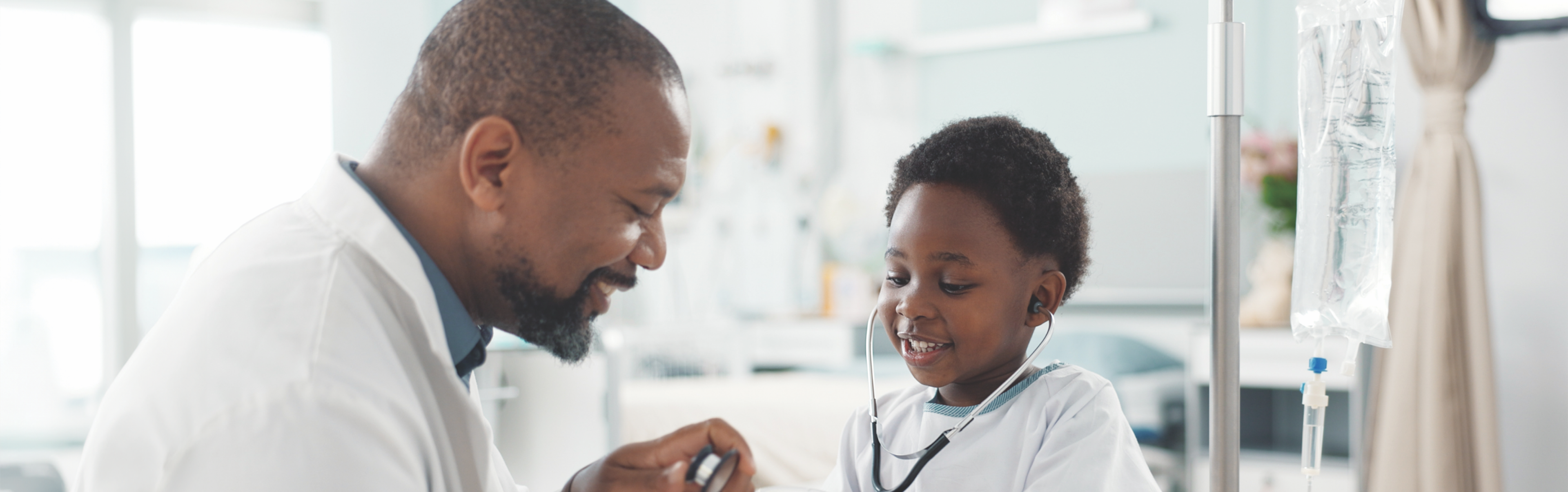 A man in a white shirt inspectioning the child