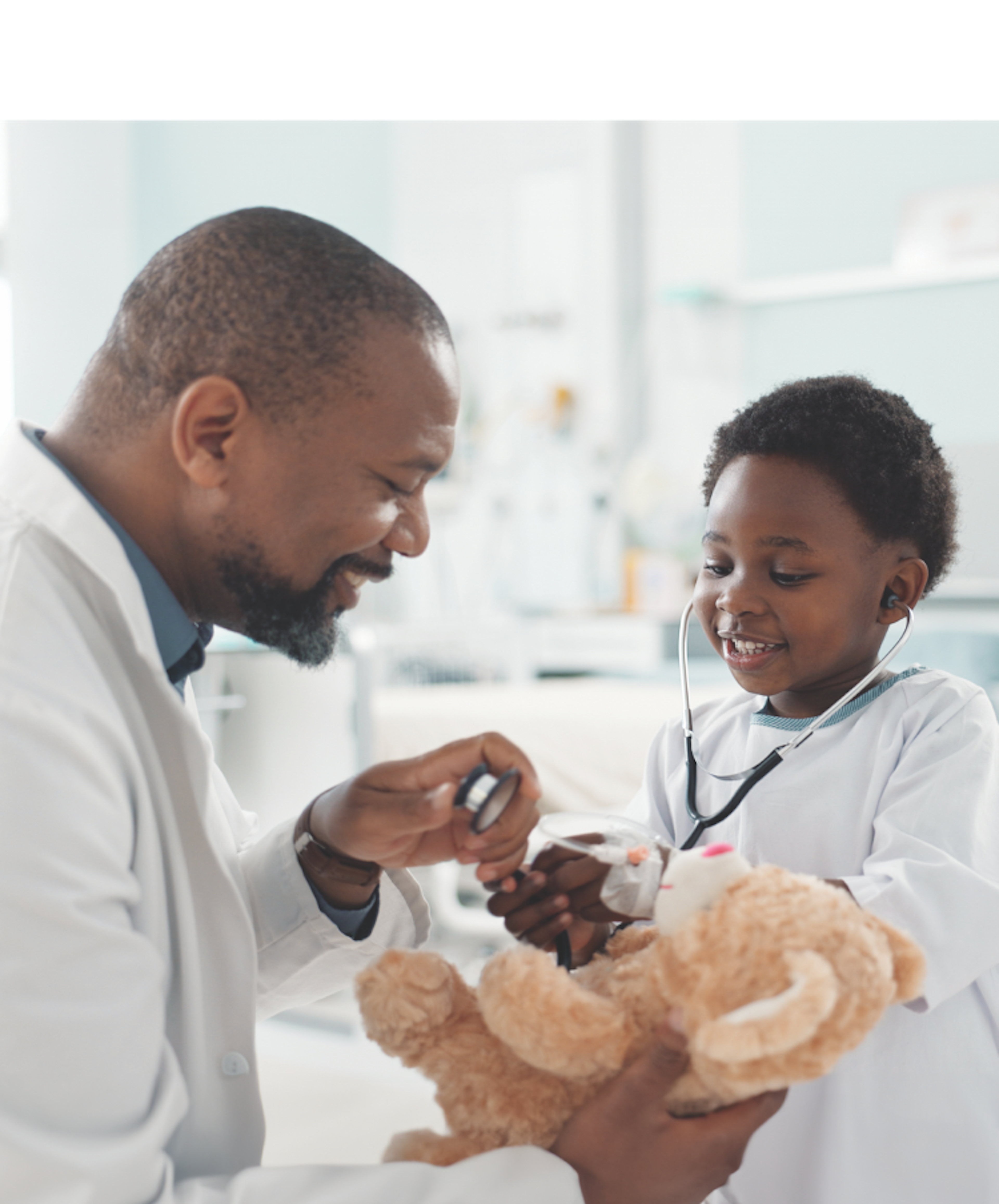 A man in a white shirt inspectioning the child