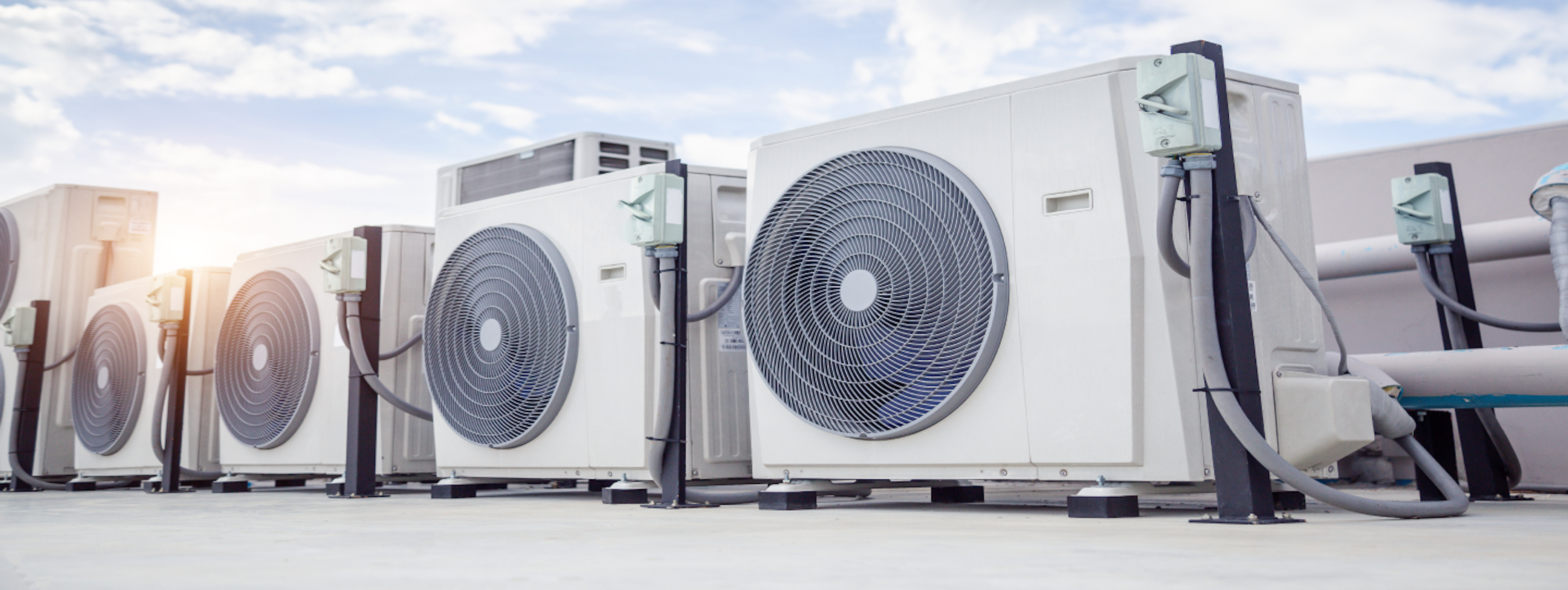 Row of air conditioners on a rooftop